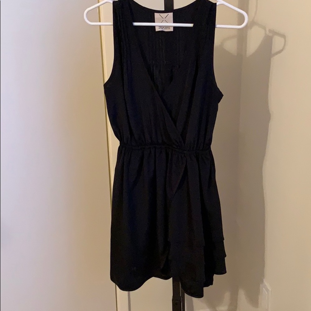Black faux-wrap dress with ruffles at bottom